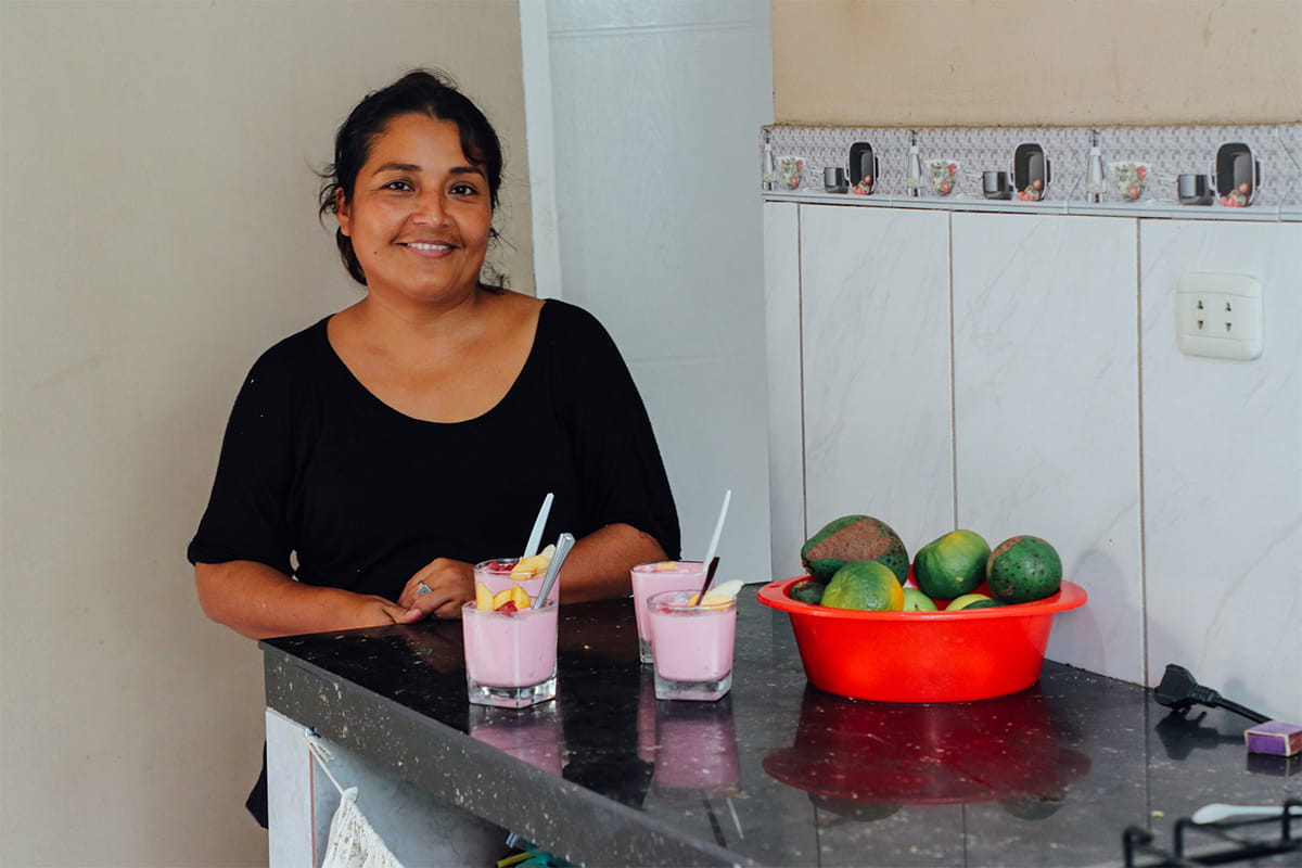 Eli lives in Bolivia where she makes and sells yogurt beverages in her home.
