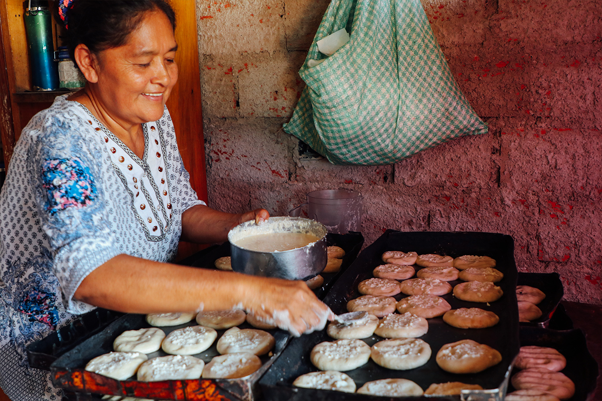 Mercedes prepares bread in the small bakery she operates out of her home in Bolivia. 