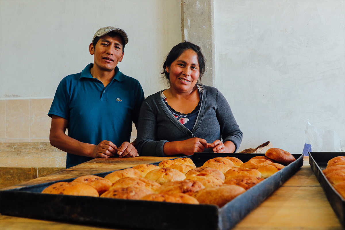 Ruben, left, and his wife Lourdes display a tray of freshly baked bread.